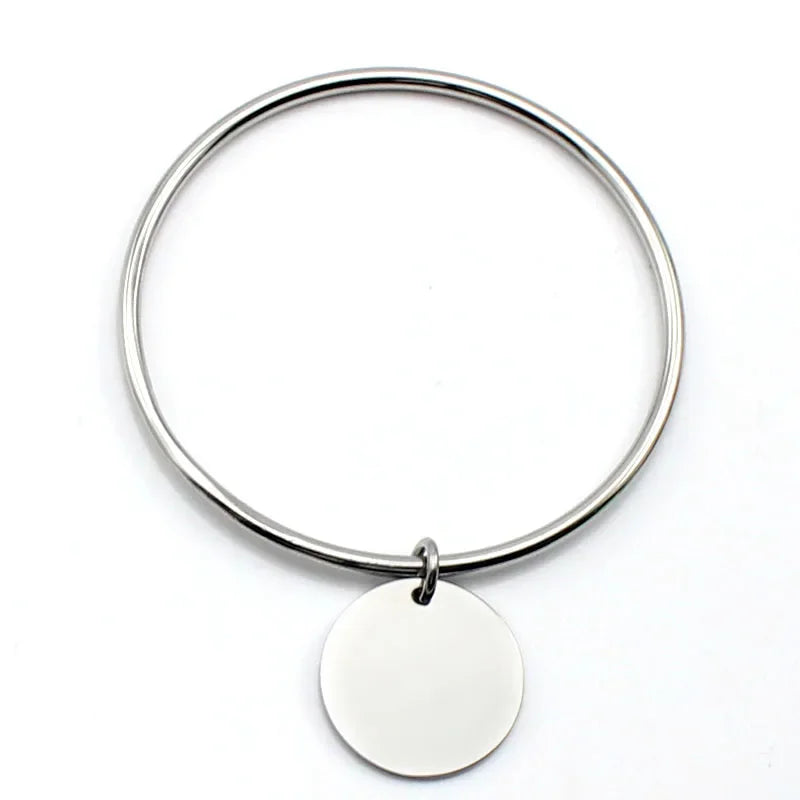 Bracelet jonc à breloques dorées en acier inoxydable