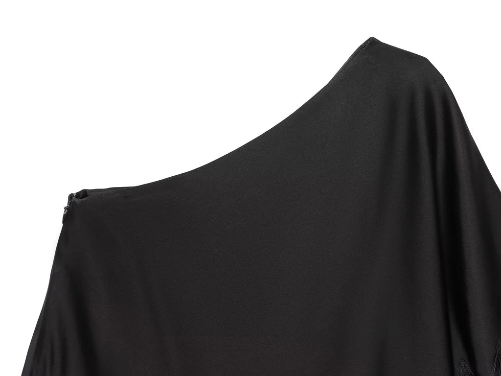 Haut en dentelle asymétrique